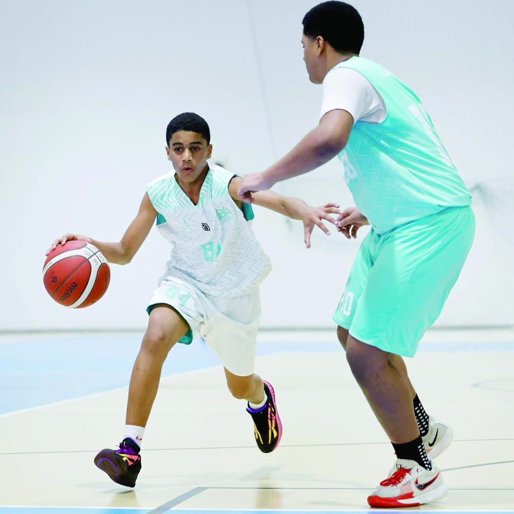 A player drives to the basket during the Athletes Preparation Centres Basketball League match between Nizwa and Al Bashayer. — Amar al Musafir