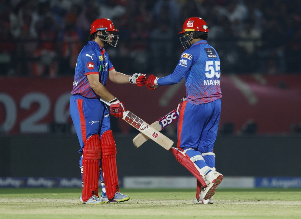  
Delhi Capitals' Madhav Tiwari and Ashutosh Sharma interact 