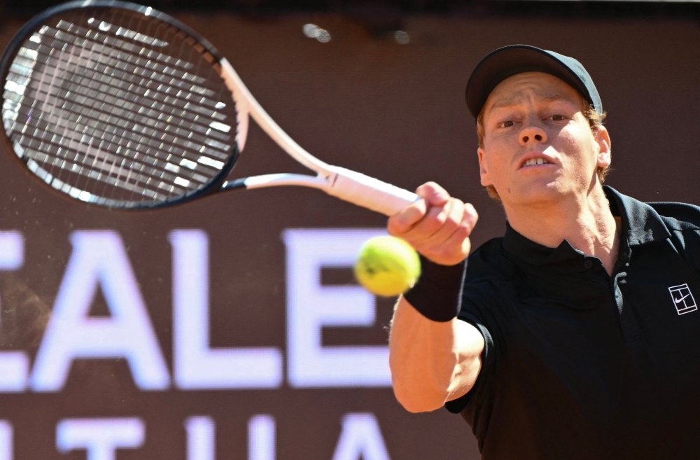  Italy's Jannik Sinner hits a return to Australia's Alexei Popyrin during the ATP Rome Open tennis tournament  

