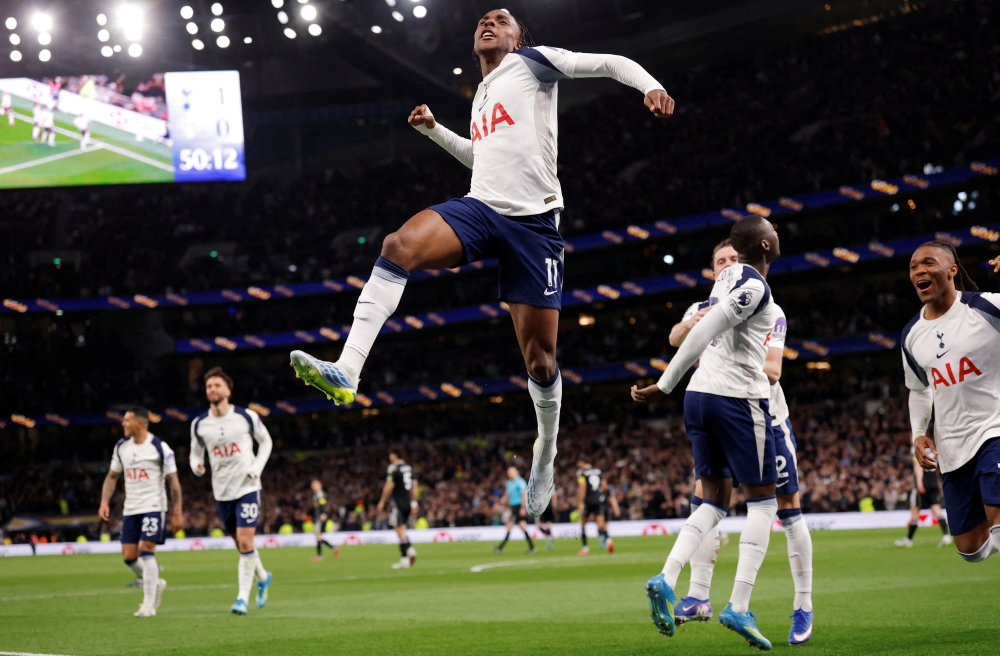  
Tottenham Hotspur's Mathys Tel celebrates scoring their first goal with Destiny Udogie  