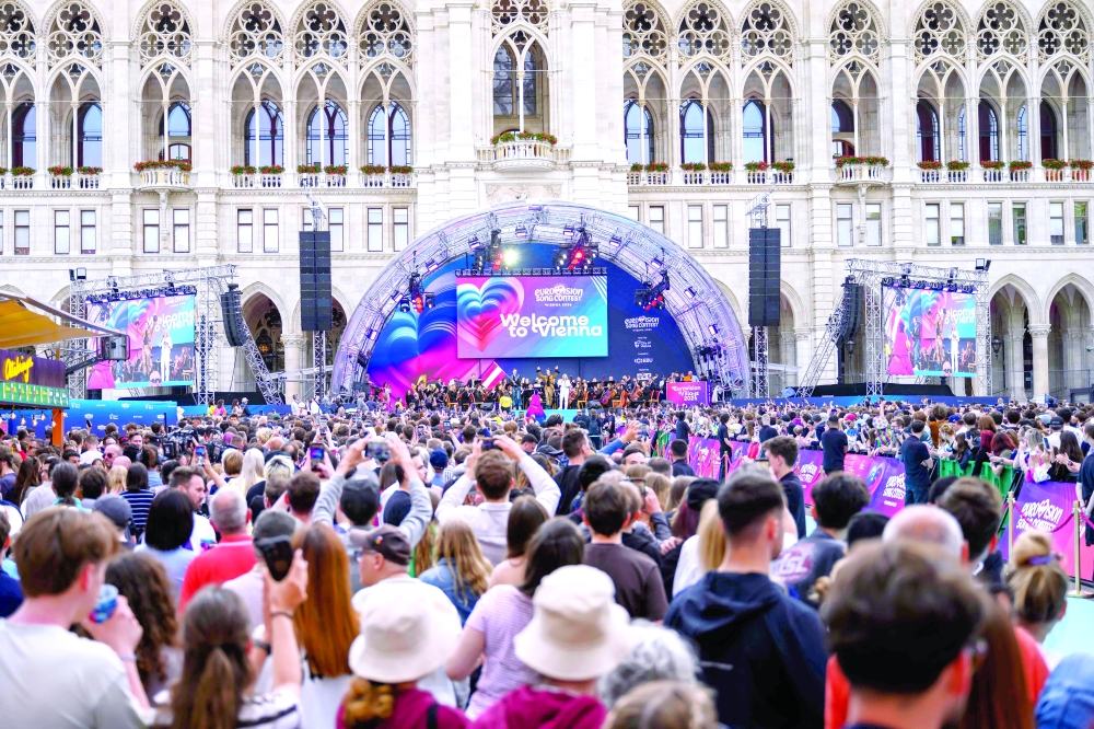 Fans attend the opening ceremony of the Eurovision Song Contest 2026 at the City Hall Square in Vienna, Austria on May 10, 2026. The event is the official starting point of Eurovision week in Vienna. The city will host the two semi-finals on May 12 and May 14 and the final on May 16, 2026. _ AFP