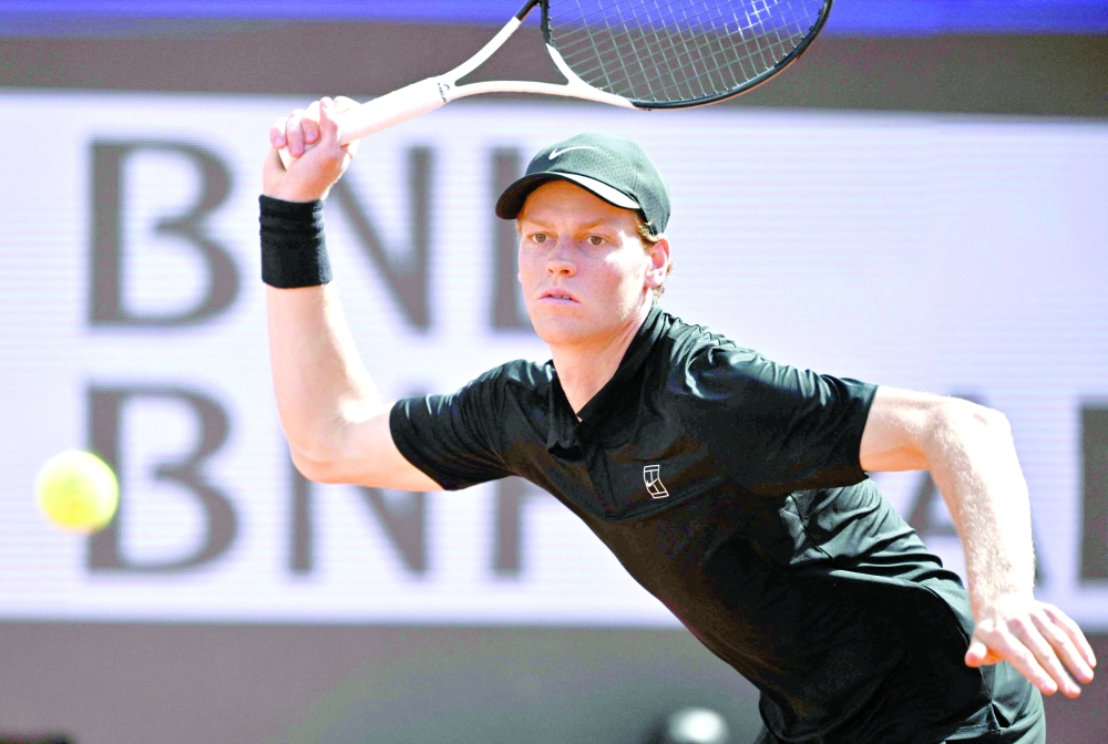 Italy's Jannik Sinner hits a return to Italy's Andrea Pellegrino during the ATP Rome Open tennis tournament at Foro Italico in Rome on May 12, 2026.   (Photo by Tiziana FABI / AFP)
