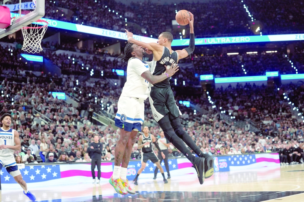 San Antonio Spurs' Victor Wembanyama (1) drives to the basket against Minnesota Timberwolves' Naz Reid (11) during game five of the second round of the 2026 NBA Playoffs at Frost Bank Center. — Imagn Images