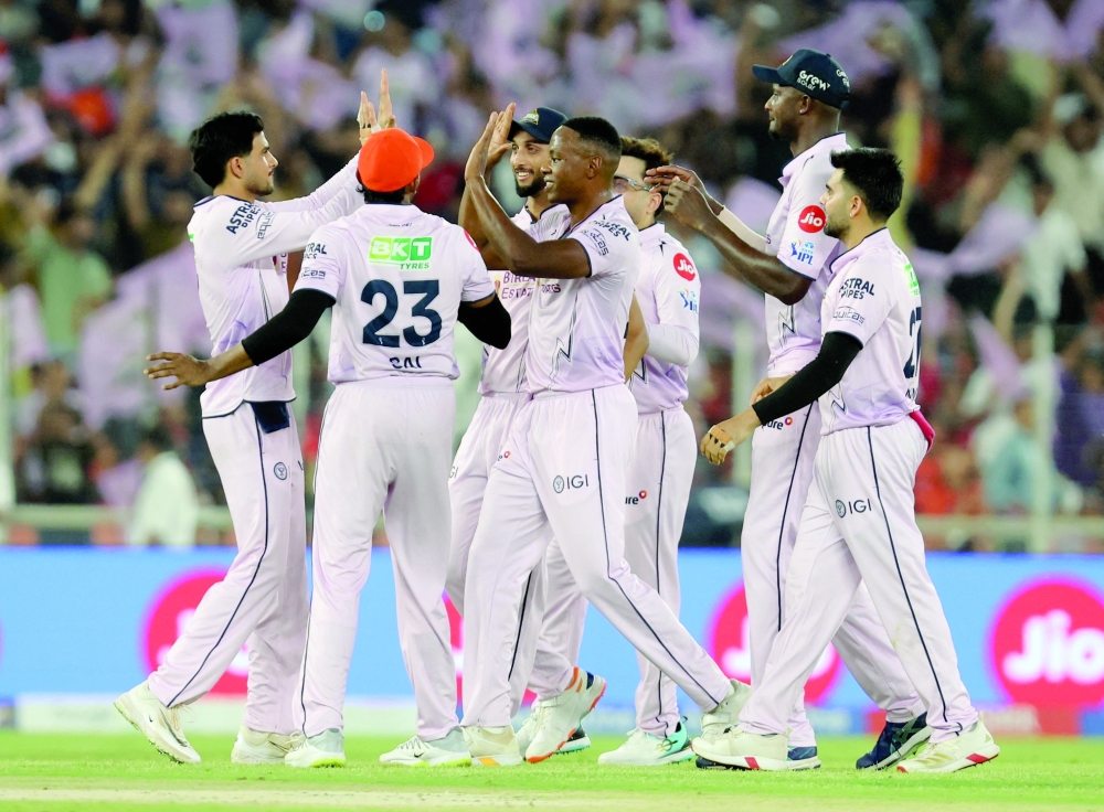Gujarat Titans' Kagiso Rabada celebrates with teammates taking the wicket of Sunrisers Hyderabad's Smaran Ravichandran. — Reuters