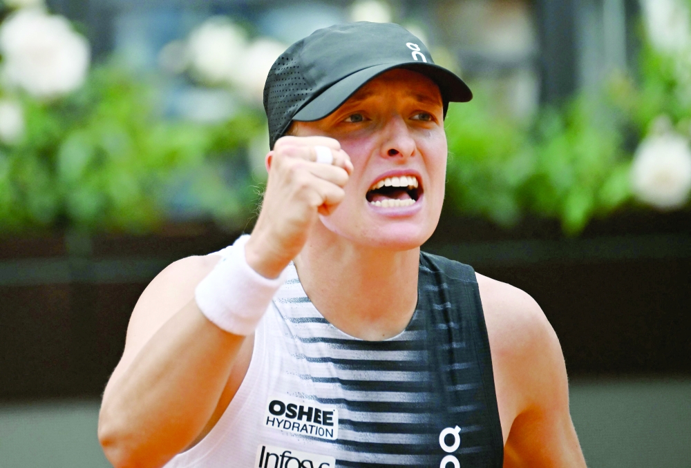 Poland's Iga Swiatek celebrates after winning against USA's Jessica Pegula during the ATP Rome Open tournament at Foro Italico in Rome. — AFP

