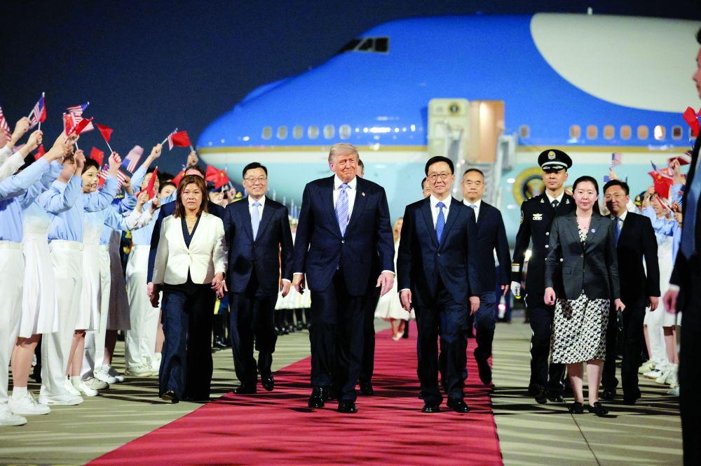 US President Donald Trump walks with Chinese Vice-President Han Zheng during an arrival ceremony at Beijing Capital International Airport. — Reuters