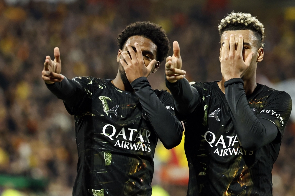  Paris Saint-Germain's French forward #49 Ibrahim Mbaye (L) celebrates with Paris Saint-Germain's French midfielder #14 Desire Doue after scoring a goal 