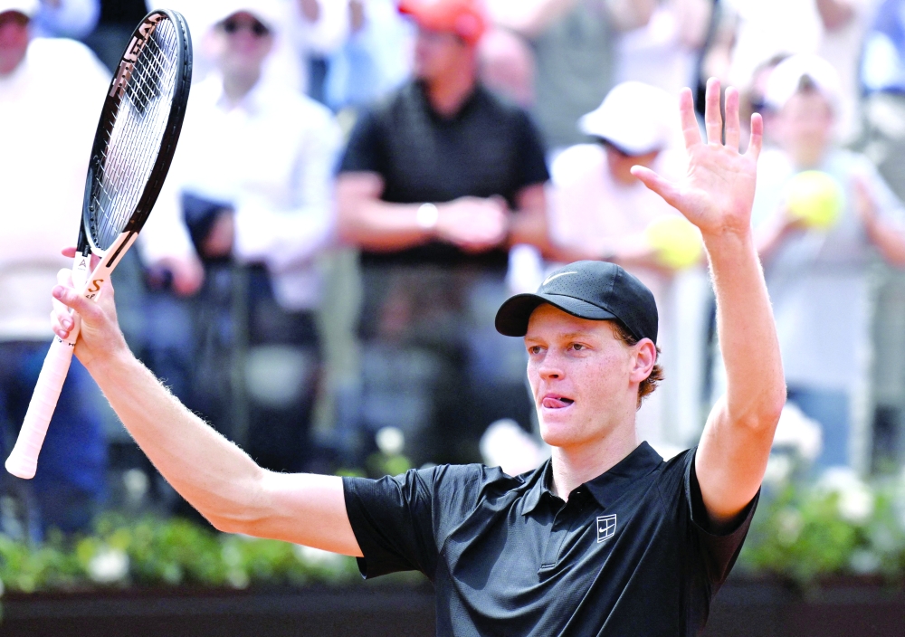 Italy's Jannik Sinner celebrates after winning against Russia's Andrey Rublev during the ATP Rome Open tennis tournament at Foro Italico in Rome on May 14, 2026.   (Photo by Tiziana FABI / AFP)
