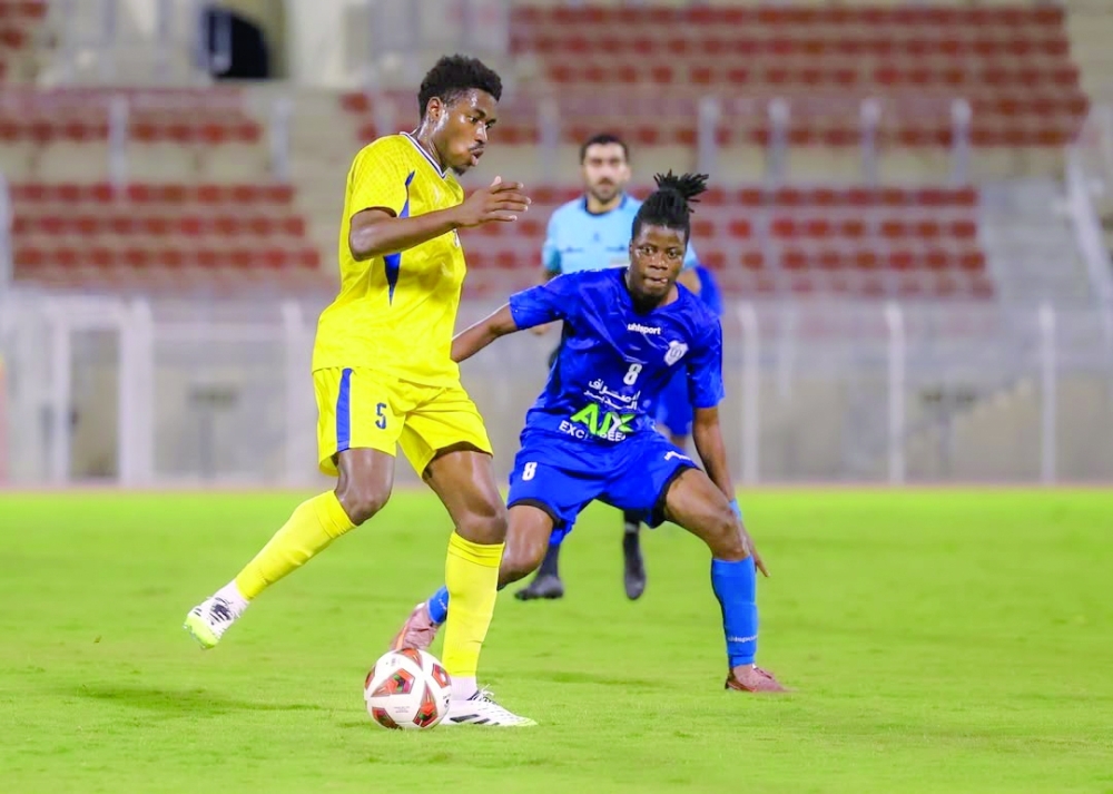 Players battle for possession during Al Nasr’s Round 24 meeting with Bahla.