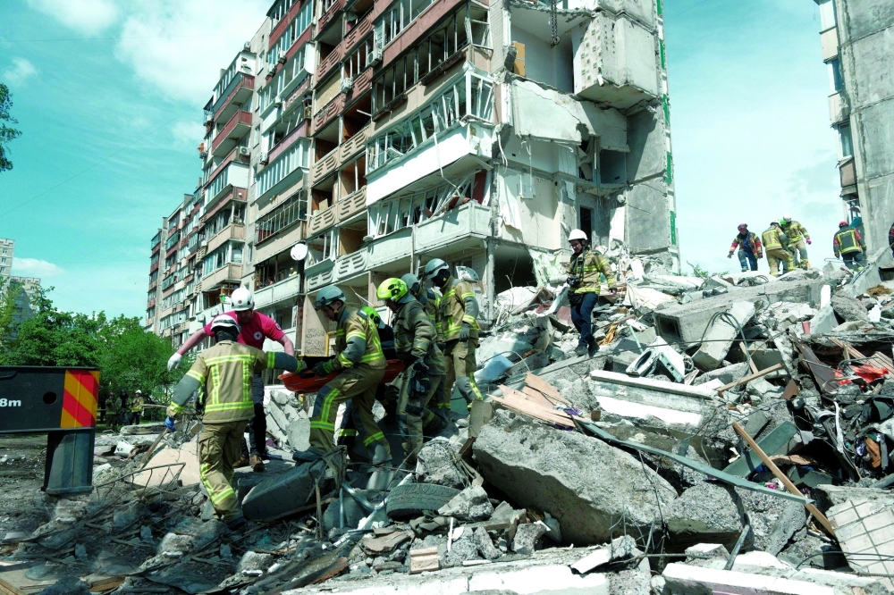 Debris at the site of an apartment building damaged during Russian missile and drone strikes, amid Russia's attack on Ukraine, in Kyiv. - AFP