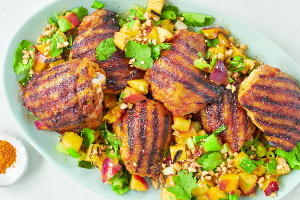 Suya-spiced grilled chicken thighs with nectarines. Yewande Komolafe has you make your own suya spice, a blend of peanuts, ginger, paprika and onion and garlic powders, then whisk it with more fresh garlic and ginger