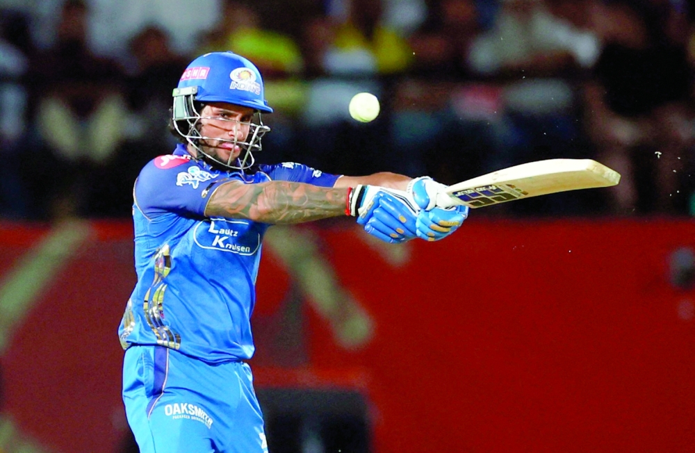 Mumbai Indians' Tilak Varma plays a shot against Punjab Kings in Dharamshala. — Reuters