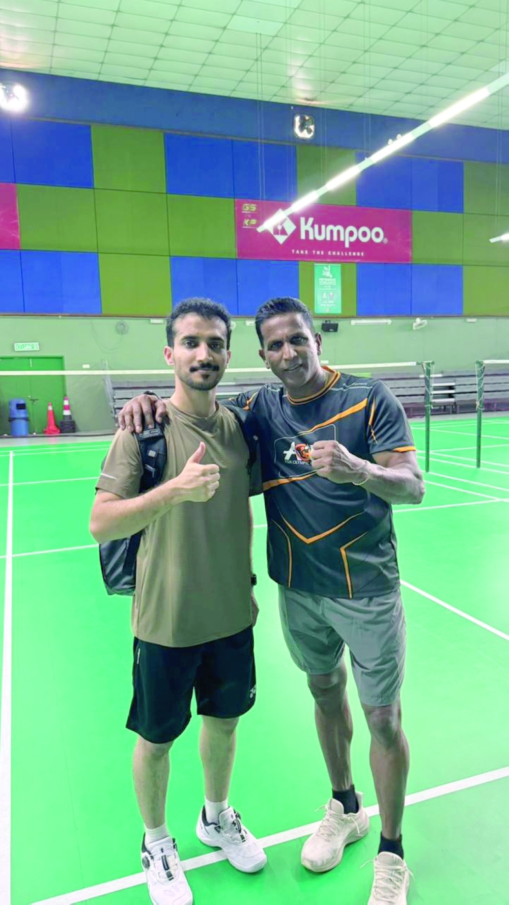 Oman coach Nasser al Jabri with the main coach of the programme.