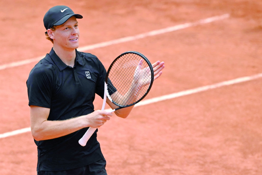 Italy's Jannik Sinner celebrates after winning the semifinal against Russia's Daniil Medvedev at the ATP Rome Open tennis tournament at Foro Italico in Rome on May 16, 2026.  (Photo by Andreas SOLARO / AFP)
