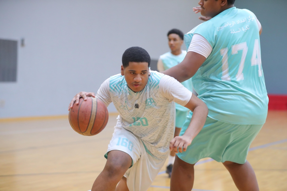Action from the latest round of the Athletes Preparation Centres Basketball League in Bausher. — Ammar al Musafir