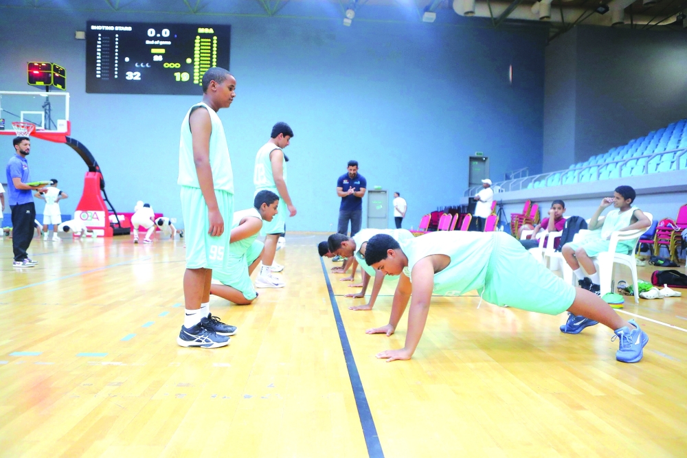 Coaches follow the practical session held alongside the players’ technical and physical assessments. — Ammar al Musafir