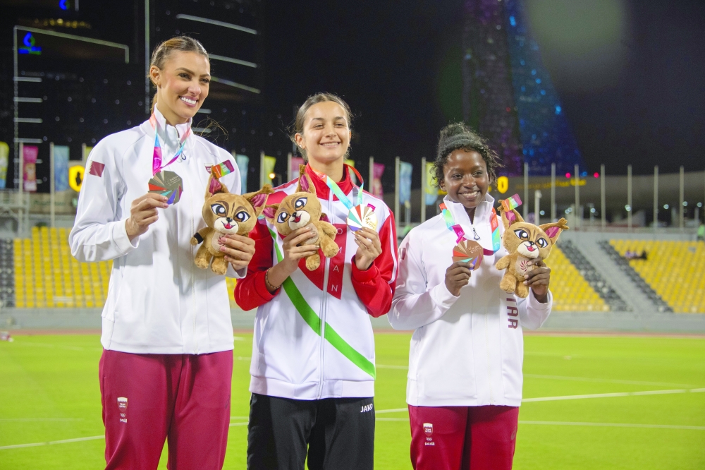 Aalia al Mughairi on the podium with the winners of the other positions.