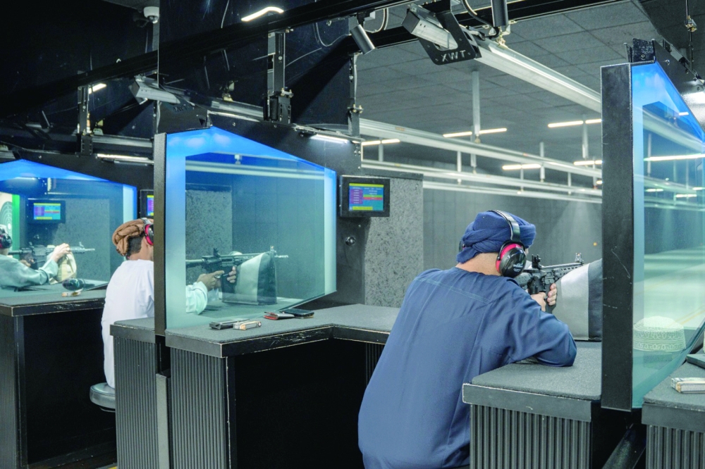 A shooter takes aim during the rifle round, with teams chasing valuable points ahead of the final day.