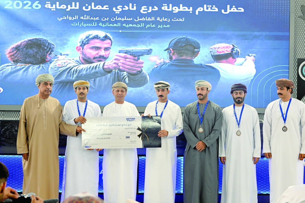 Al Failaq team members on the podium after securing second place in the Oman Shooting Club Shield Championship. — Hussein al Muqbali