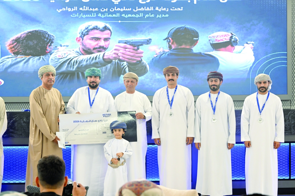 Black Falcon team members celebrate their third-place finish at the end of the championship. — Hussein al Muqbali