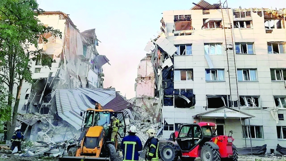 Rescuers work amid debris of a destroyed dormitory building of the Starobilsk College of Luhansk Pedagogical University. — Reuters 