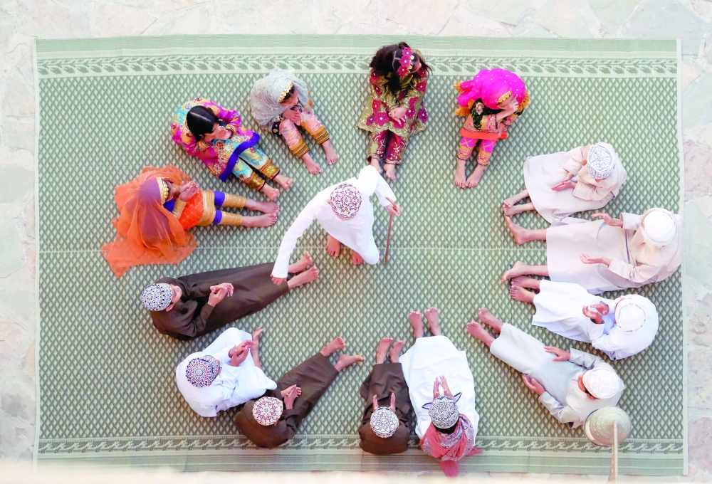 Omanis gather in open courtyards in old Nizwa town