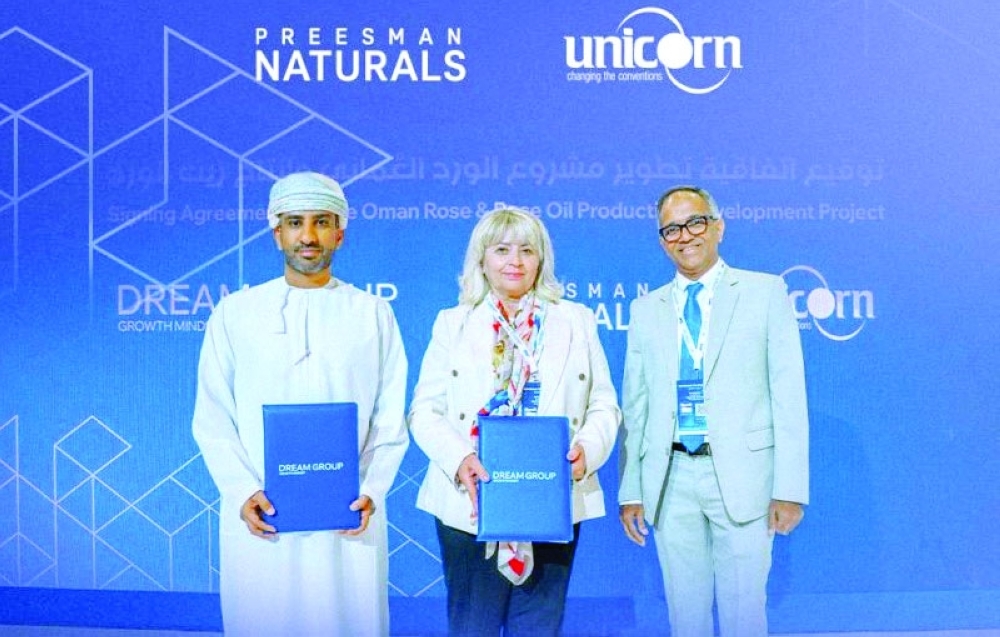 Executives representing the three partners at the agreement signing 