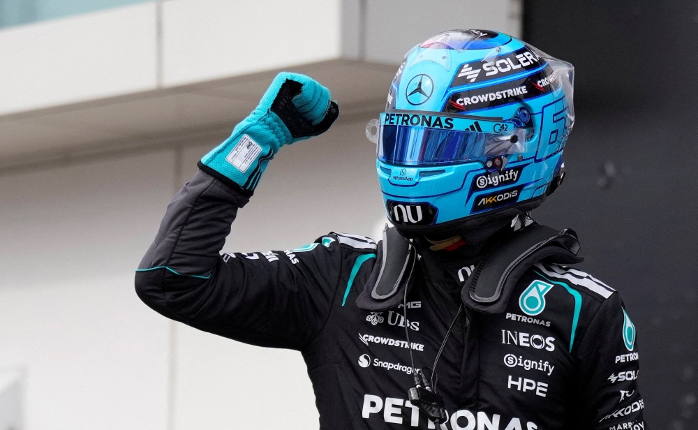  
Mercedes' George Russell celebrates after qualifying in pole position     