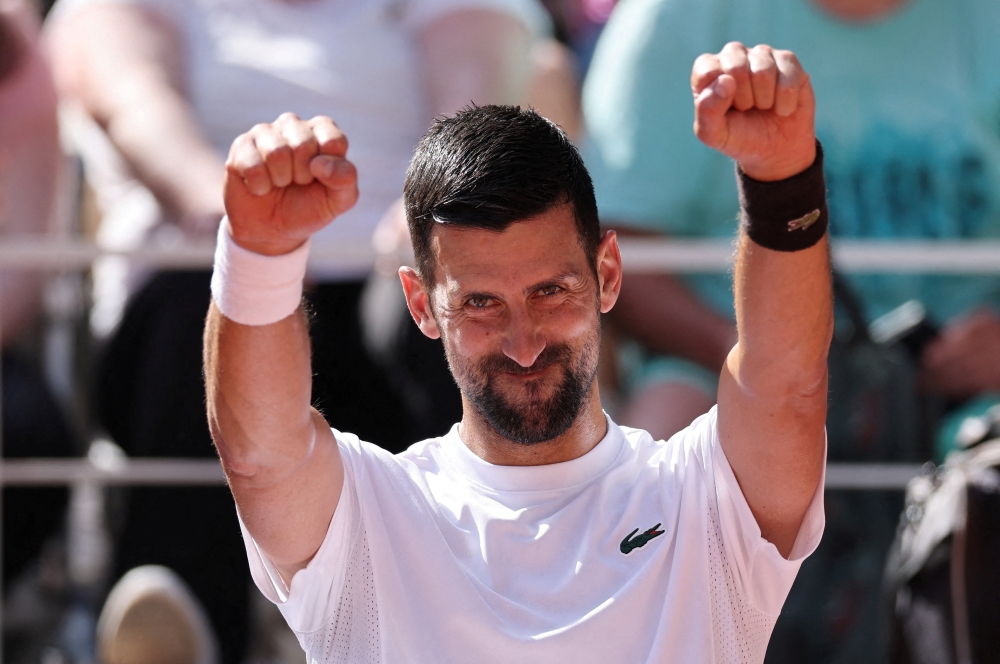  
Serbia's Novak Djokovic reacts during practice ahead of the French Open  