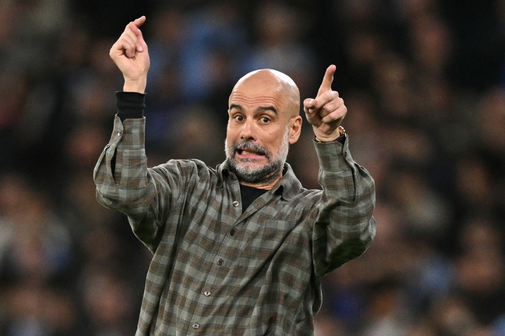 (FILES) (FILES) Manchester City's Spanish manager Pep Guardiola  