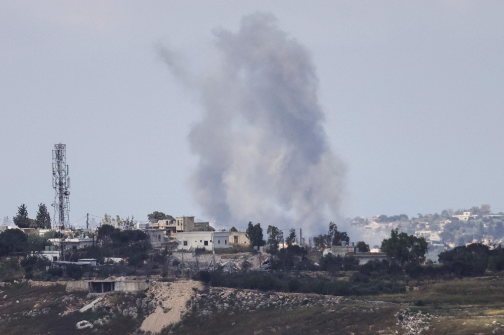 Smoke rises following an Israeli strike on the southern village of Zawtar El Charkiyeh on May 24, 2026. 