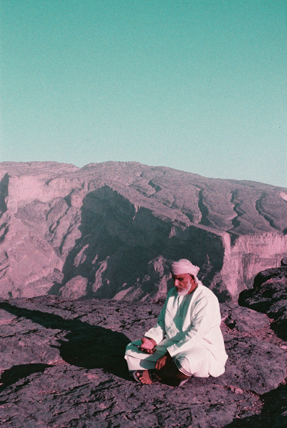 Omani on top of Jabal Shams known for its dramatic canyon landscapes and cooler climate