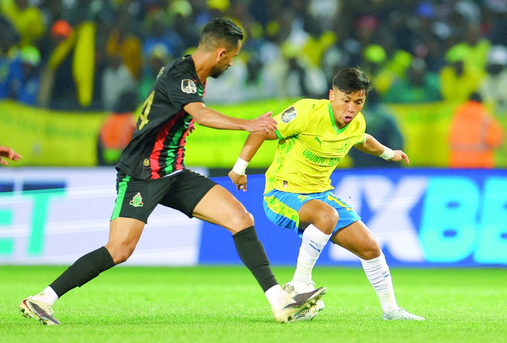Mamelodi Sundowns' Marcelo Allende in action with AS FAR's Mohamed Hrimat.  — Reuters