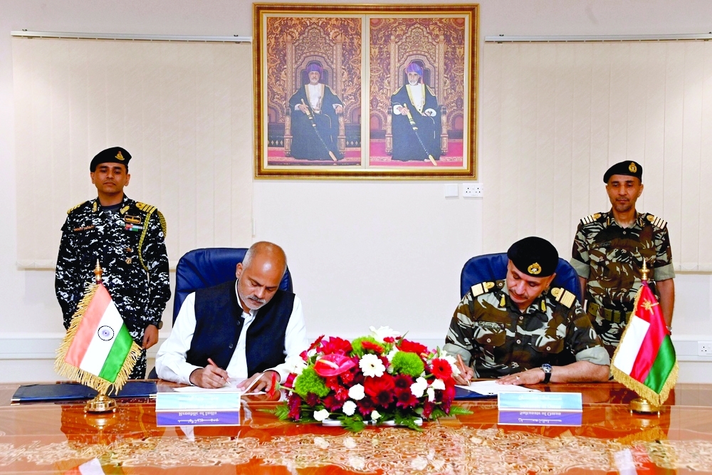 Rear Admiral Saif bin Nasser al Rahbi, Commander of the Royal Navy of Oman (RNO), and Srinivas signing the MoU