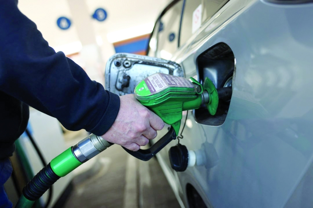 A motorist fills their car with unleaded fuel at a petrol station in London, Britain. — Reuters