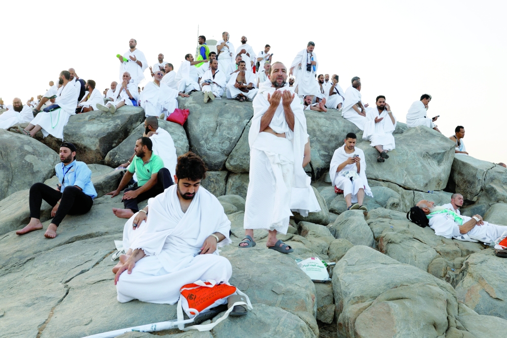 Muslim pilgrims gather at Mount of Mercy on the plain of Arafat as the sun rises during the annual Haj pilgrimage, outside the holy city of Mecca. - Reuters