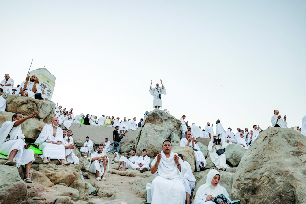 Muslim pilgrims gather at Mount of Mercy on the plain of Arafat. - Reuters