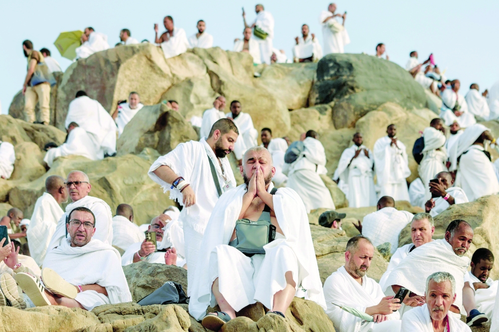 Pilgrims pray on Mount Arafat, also known as Jabal Al Rahma or Mount of Mercy, during the climax of the Haj pilgrimage early on Tuesday. - AFP