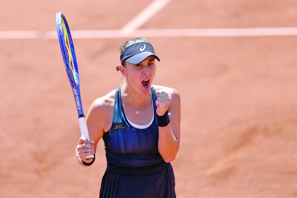 Switzerland's Belinda Bencic celebrates after winning against US Caty McNally at the end of their women's singles match on day 4 of the French Open tennis tournament on Court Simonne-Mathieu at the Roland-Garros Complex in Paris on May 27, 2026. (Photo by Anne-Christine POUJOULAT / AFP)
