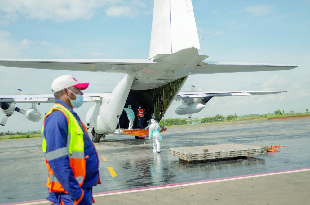 Unicef staff and airport workers during an unloading operation for aid consignments by Unicef and the European Civil Protection and Humanitarian Aid Operations (ECHO), concerning the Ebola outbreak at Bunia National Airport in Bunia, Ituri province, DRC. - Reuters