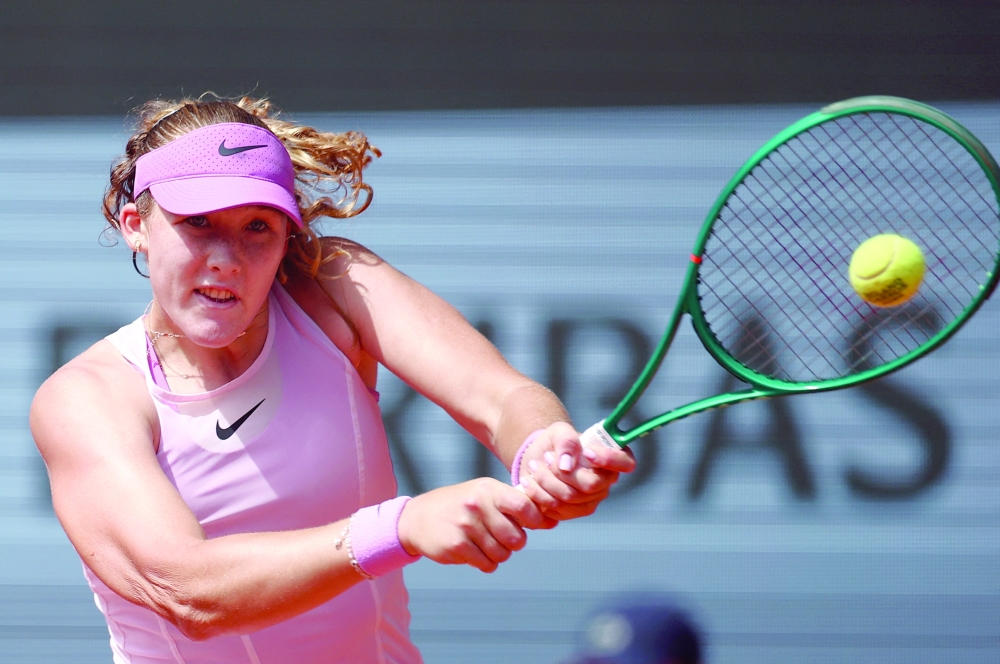 Russia's Mirra Andreeva in action during her third round match against Czech Republic's Marie Bouzkova.