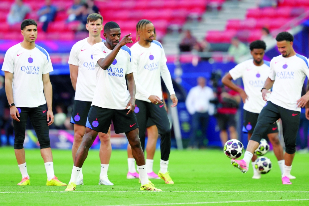 Paris Saint-Germain's players including French forward #10 Ousmane Dembele (C) take part in a MD-1 training session of his players on May 29, 2026, the eve of the UEFA Champions League final football match between Paris Saint-Germain (PSG) and Arsenal at the Puskas Arena in Budapest.
 Paris Saint-Germain (PSG) face Arsenal in the UEFA Champions League final football match on May 30, 2026 in Budapest. (Photo by FRANCK FIFE / AFP)
