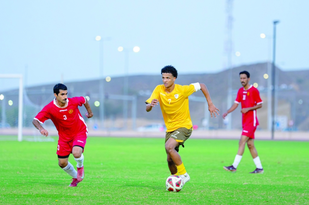 Oman U20 team player in action during a local friendly match.