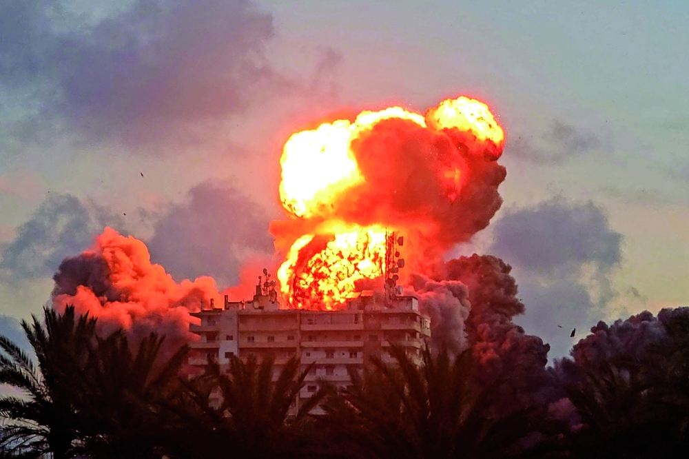 A fireball erupts from a building following an Israeli strike in Tyre, southern Lebanon. — AFP