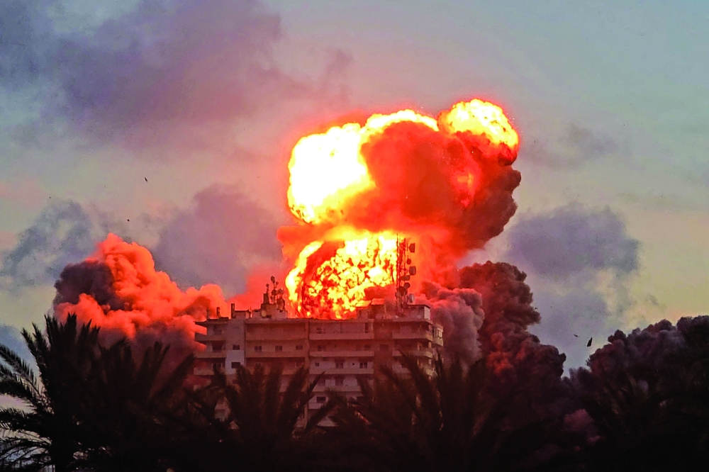 A fireball erupts from a building following an Israeli strike in Tyre, southern Lebanon. — AFP