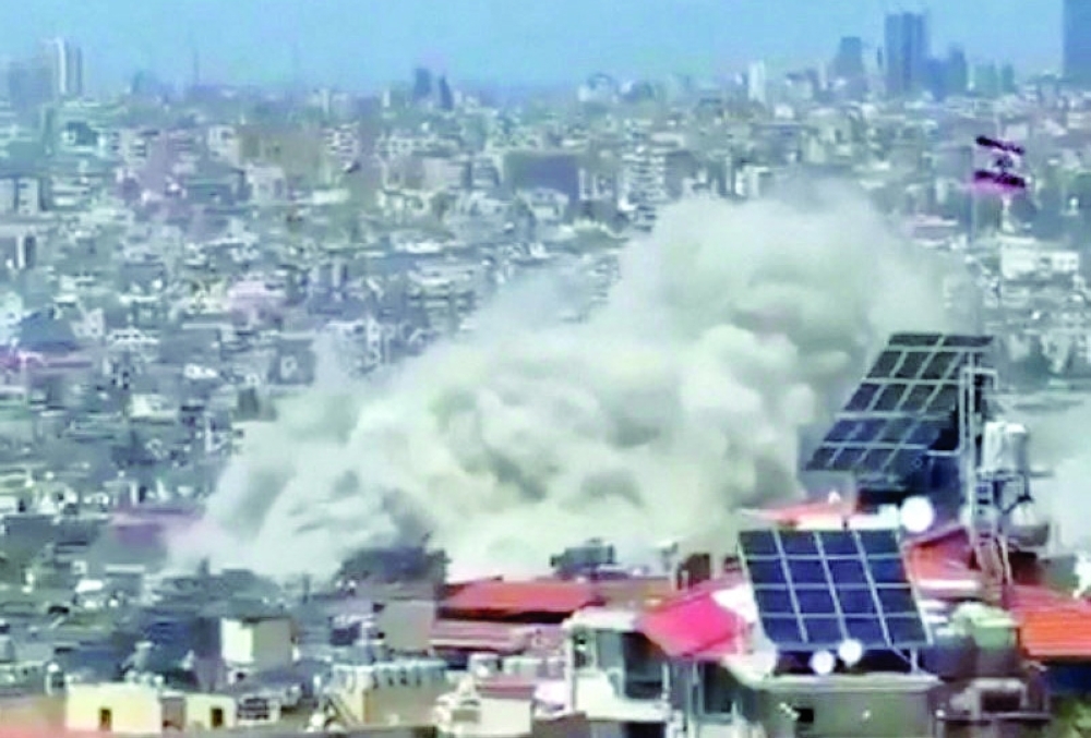 Plume of smoke rises following an Israeli strike, in Choueifat, Lebanon. — Reuters