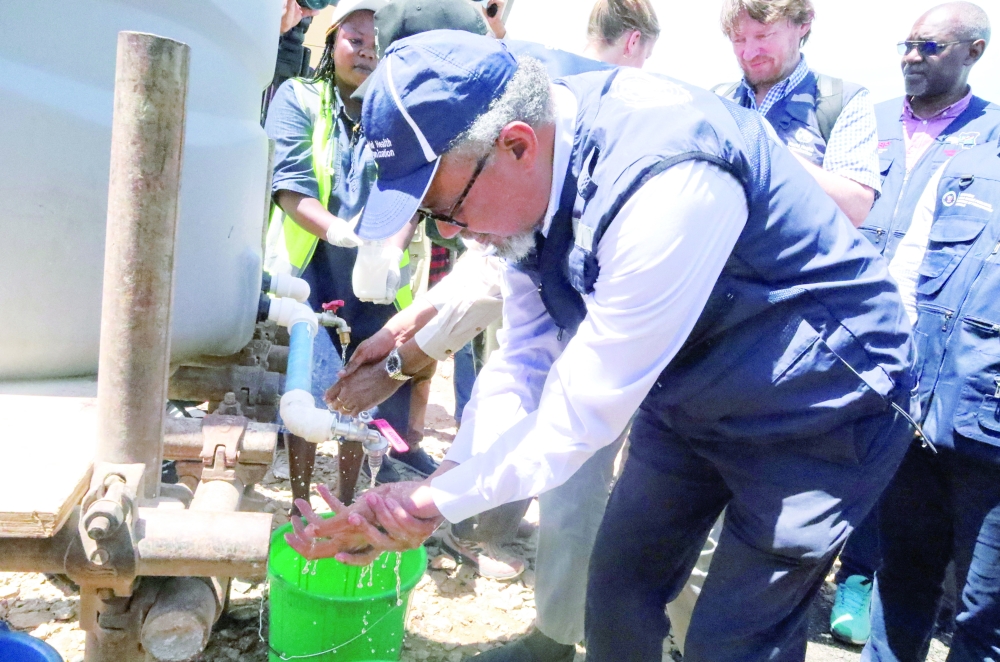 WHO Director-General Tedros Adhanom Ghebreyesus washes his hands as he arrives in DRC to coordinate the response to the Ebola outbreak. — Reuters