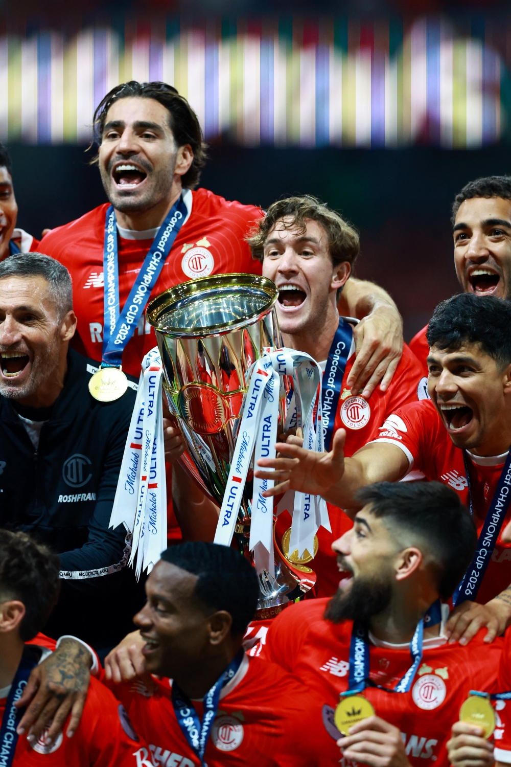 
Toluca players celebrate with the trophy after winning the CONCACAF Champions Cup 