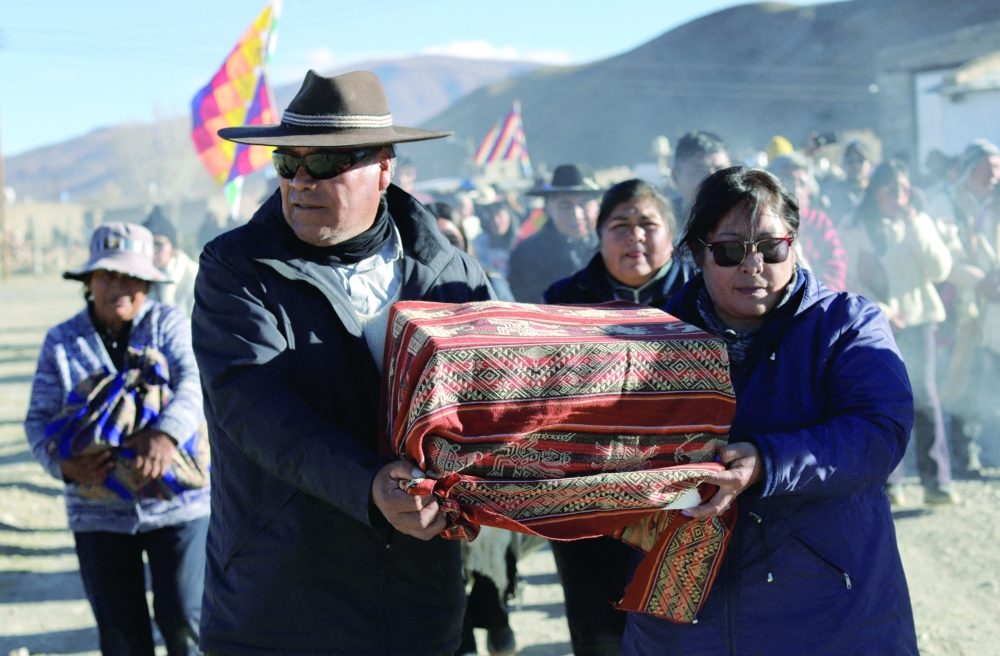 People participate in a ceremony following the return of the so-called "Child of Chani”, an Inca-era child mummy found frozen in 1905 at nearly 5,900 metres on a mountain, after being returned to a local indigenous community following about 120 years in a Buenos Aires museum. — Reuters