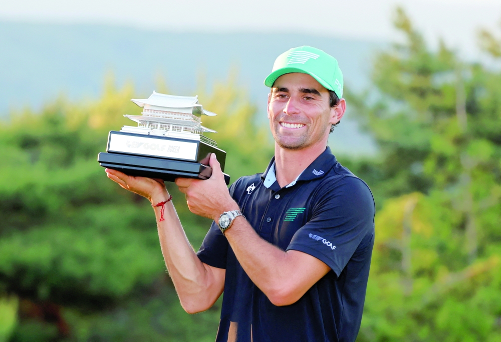Torque GC's Joaquin Niemann celebrates with the trophy after winning LIV Golf. — Reuters